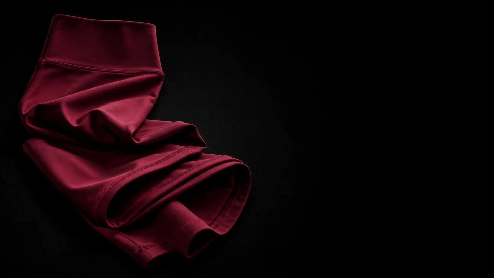 Buttery cherry-red seamless legging waistband detail