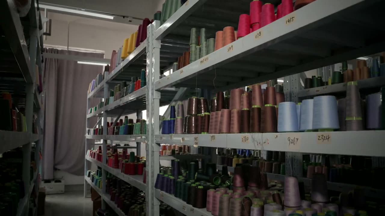 Yarn cones on the shelves of the yarn store