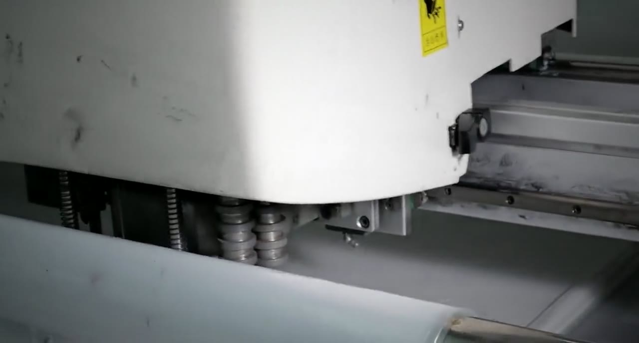 Automated fabric spreading ahead of cutting